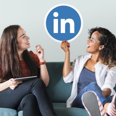 Women holding a Linkedin logo